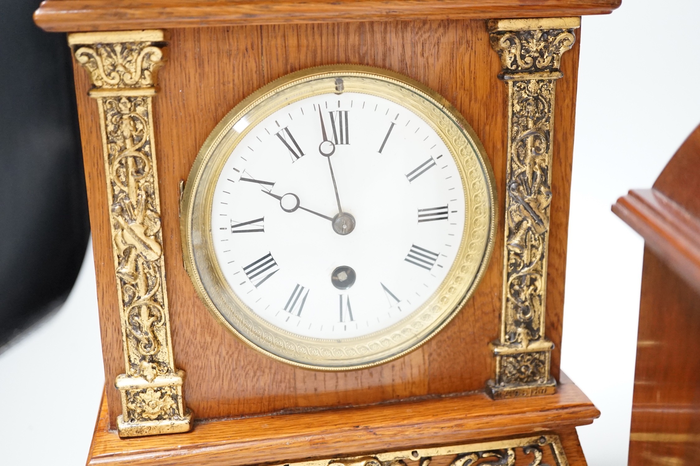 A Garrard clock and an oak brass mounted clock 29cms high